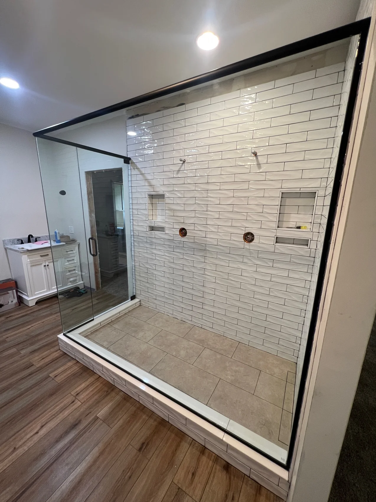Custom shower enclosure with black grid hardware